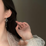 Asymmetrical Fringed Mosquito Coil Ear Clip – Stylish Gifts — 1