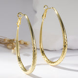 Golden Glossy Spring Fastener Egg-shaped Earrings – Thoughtful Gifts — 2