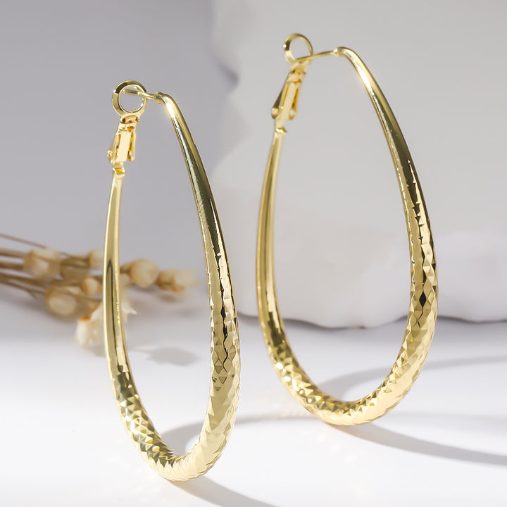 Golden Glossy Spring Fastener Egg-shaped Earrings – Thoughtful Gifts — 1