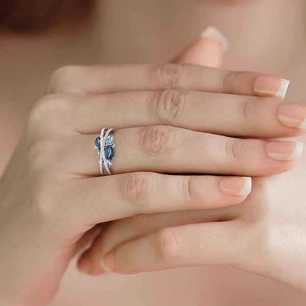 Creative New X-shaped Hollow Sea Blue Zircon Ring – Small Gift Ideas — 1