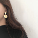 Geometric exaggerated metal wafer earrings – Meaningful Gifts — 2